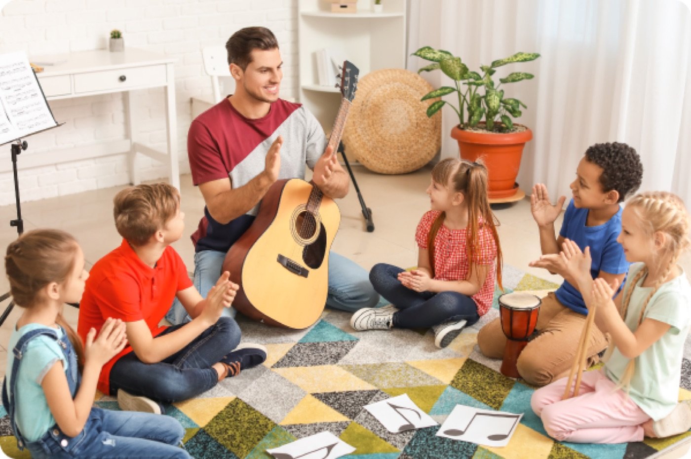 Children sitting in a circle making music together