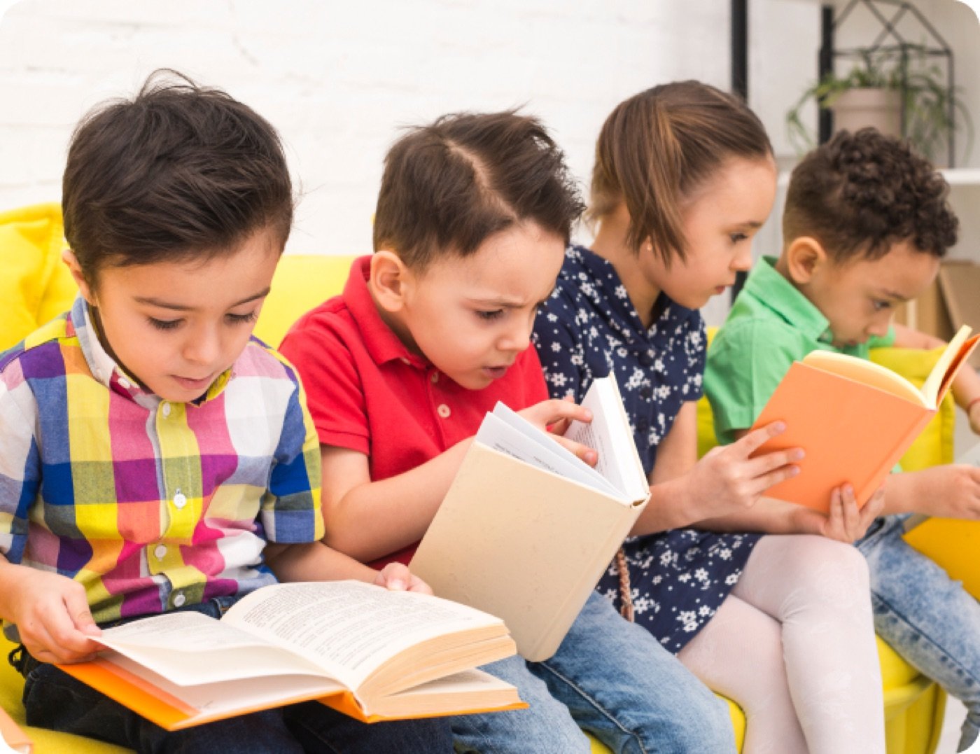 Young children reading colorful books together
